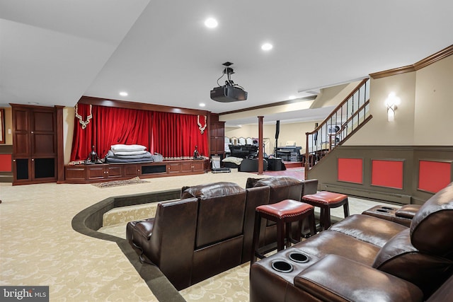 home theater room featuring carpet floors and a baseboard radiator