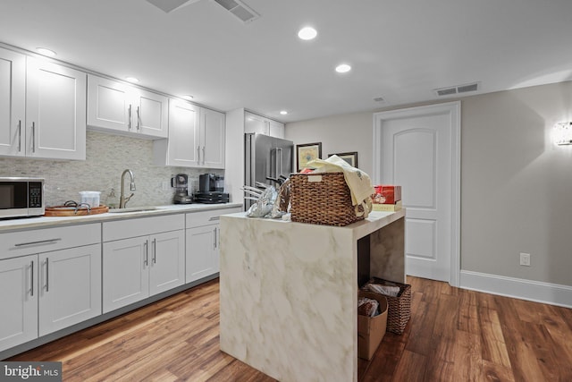 kitchen with white cabinetry, sink, and appliances with stainless steel finishes