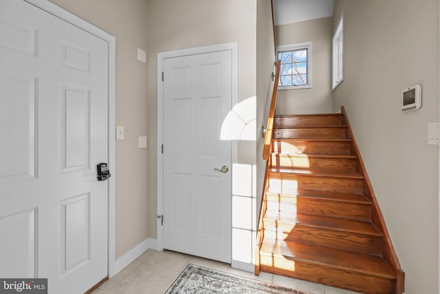 entryway featuring light tile patterned floors