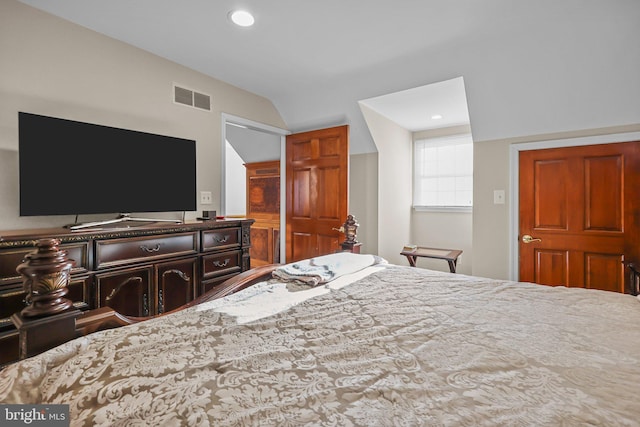 bedroom with lofted ceiling