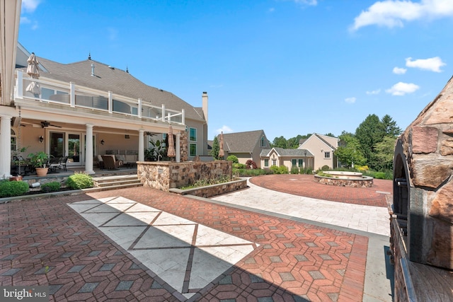 view of patio / terrace featuring a balcony and ceiling fan