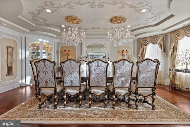 dining room featuring a raised ceiling, dark hardwood / wood-style flooring, and crown molding