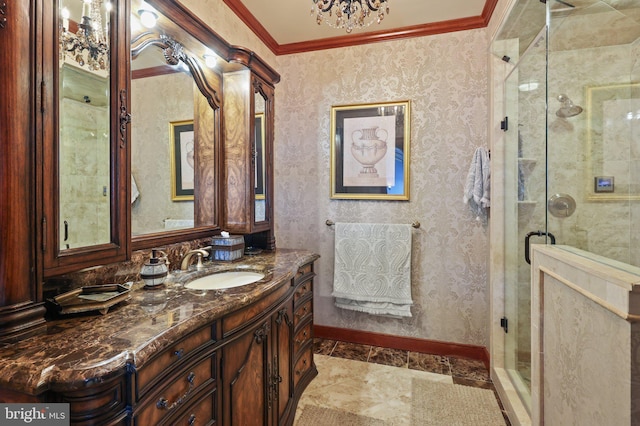 bathroom featuring a notable chandelier, vanity, crown molding, and walk in shower