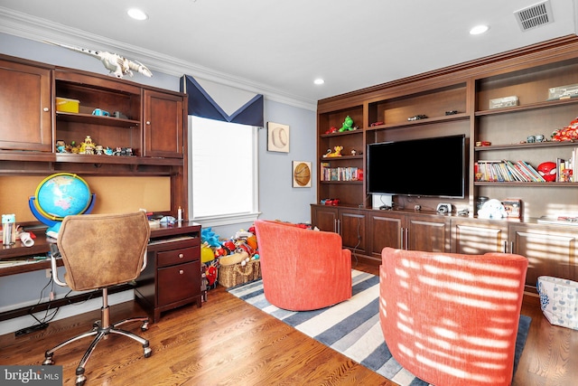 office area featuring ornamental molding and light wood-type flooring