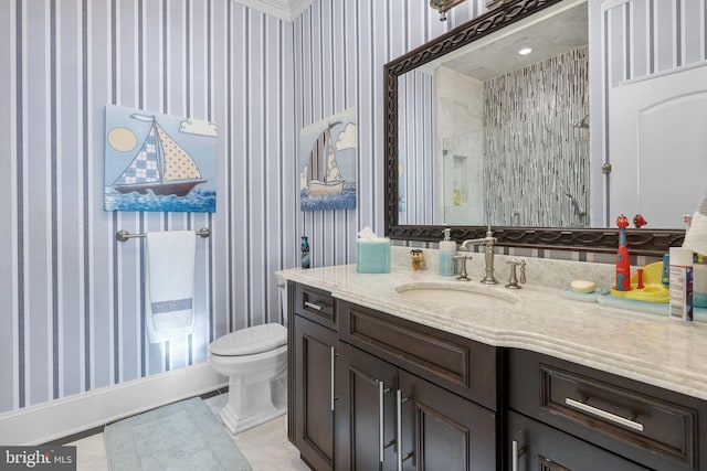 bathroom with a tile shower, tile patterned flooring, vanity, and toilet