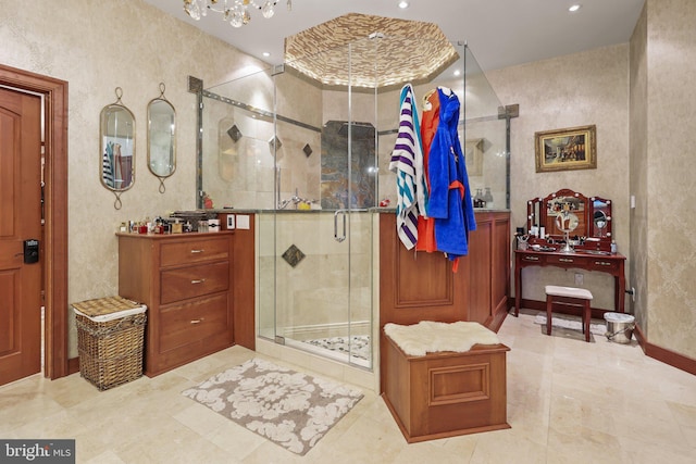 bathroom featuring vanity and an enclosed shower