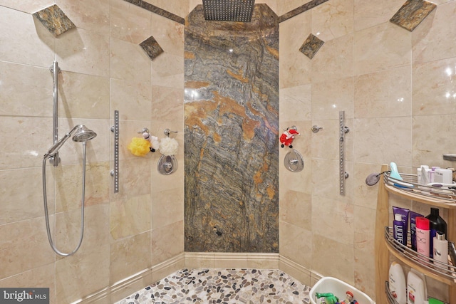 bathroom with tiled shower