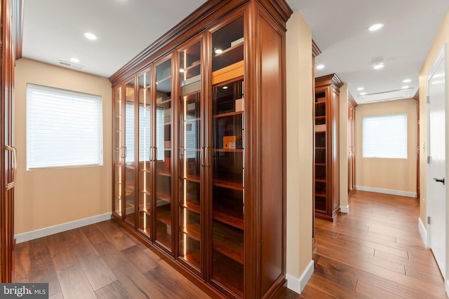 hall with dark hardwood / wood-style flooring