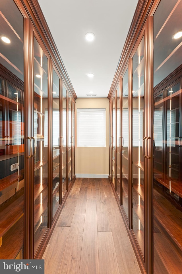 interior space featuring french doors, hardwood / wood-style flooring, and crown molding