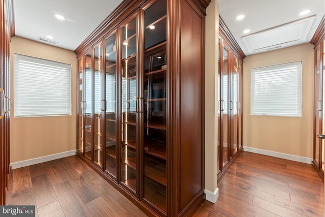 interior space featuring dark hardwood / wood-style floors and ornamental molding