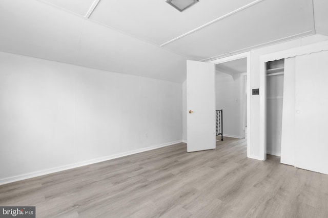 additional living space featuring light wood-type flooring