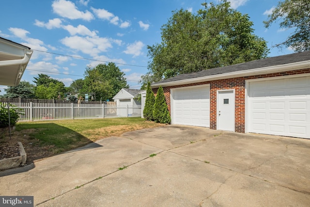 garage with a lawn