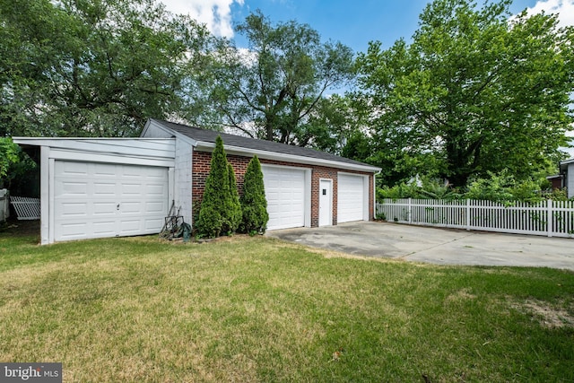 garage with a lawn