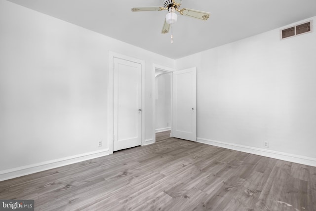 unfurnished room featuring ceiling fan and light hardwood / wood-style flooring