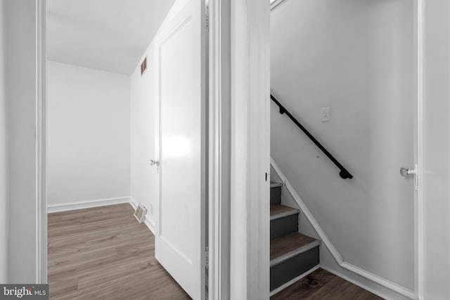 staircase featuring hardwood / wood-style floors