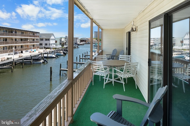 balcony featuring a water view