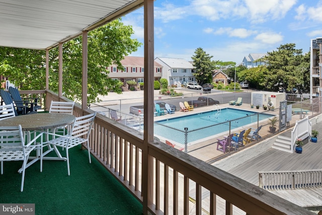 view of pool featuring a wooden deck