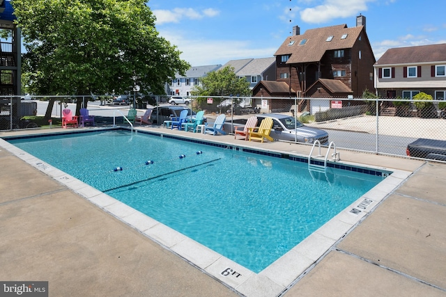 view of swimming pool with a patio area