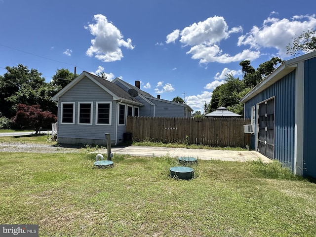 exterior space featuring a yard and cooling unit