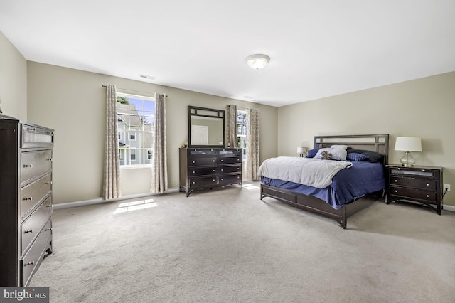 bedroom featuring light colored carpet