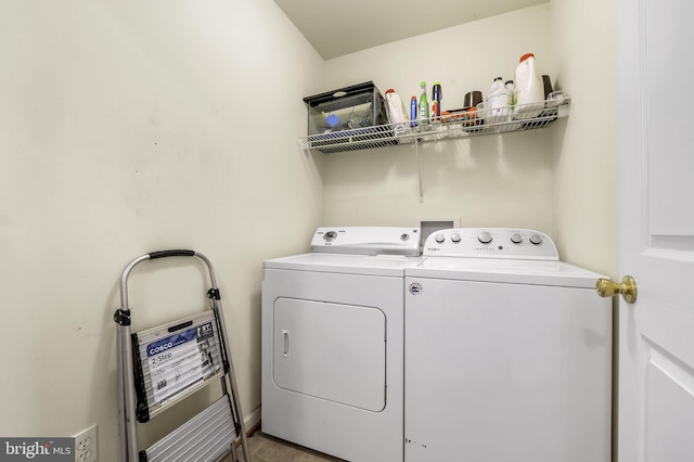 washroom with washer and dryer and light hardwood / wood-style floors