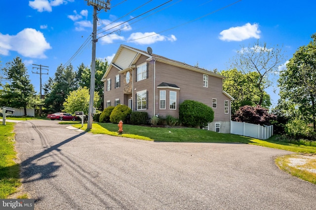 view of home's exterior with a yard