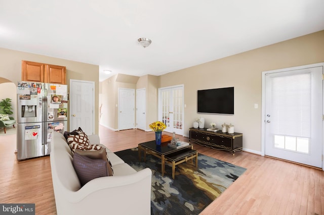 living room with light hardwood / wood-style flooring