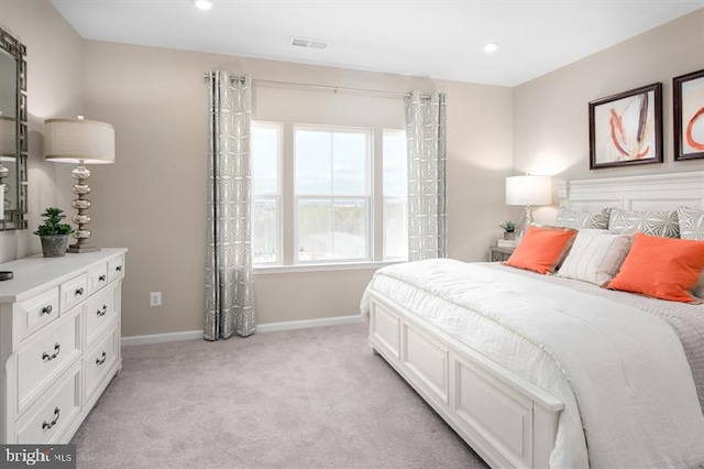 bedroom featuring light colored carpet