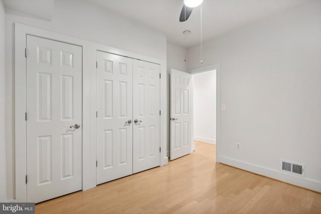 unfurnished bedroom with light hardwood / wood-style floors and ceiling fan