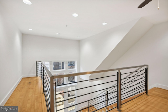 interior space with ceiling fan and wood-type flooring