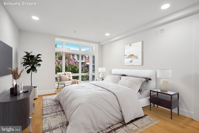 bedroom with light hardwood / wood-style floors