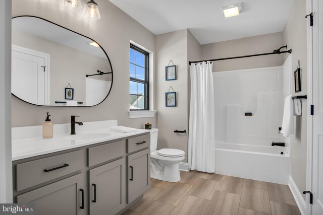 263 Breeches Run Unit 76, Boiling Springs, PA 17007 - bathroom featuring vanity, toilet, shower / bath combination with curtain, and baseboards