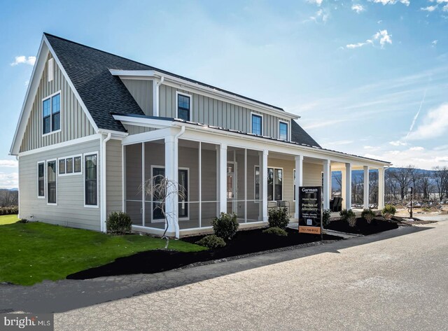 263 Breeches Run Unit 76, Boiling Springs, PA 17007 - view of front facade featuring board and batten siding, roof with shingles, and a front yard