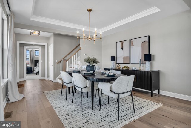 263 Breeches Run Unit 76, Boiling Springs, PA 17007 - dining room featuring a tray ceiling, stairway, a chandelier, ornamental molding, and wood finished floors