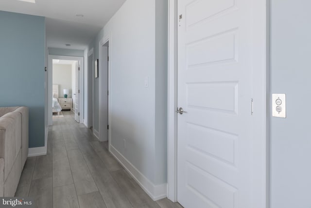 hall with light wood-type flooring