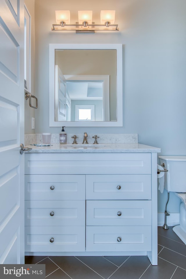 bathroom featuring tile patterned floors and vanity