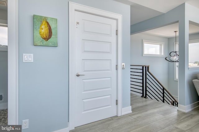 entrance foyer featuring light wood-type flooring