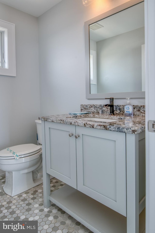 bathroom with vanity and toilet