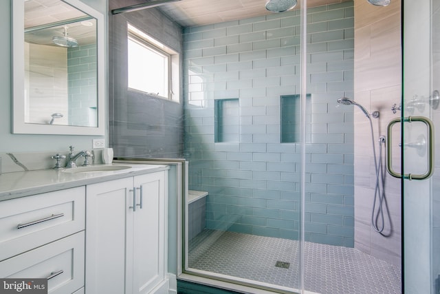 bathroom with vanity and an enclosed shower