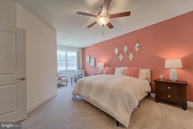 bedroom with ceiling fan and light colored carpet