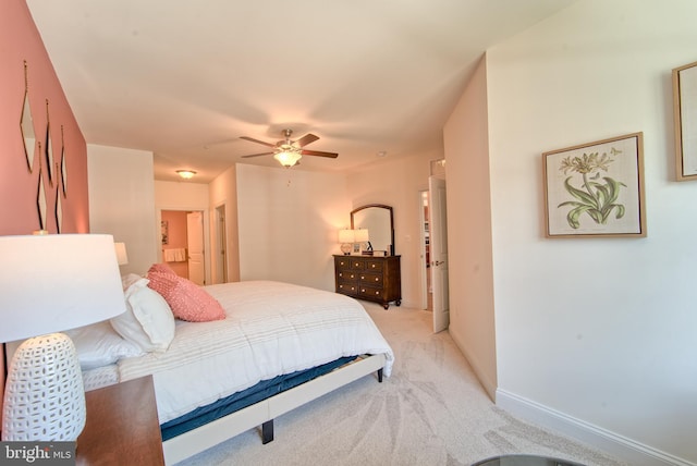 bedroom featuring light carpet and ceiling fan