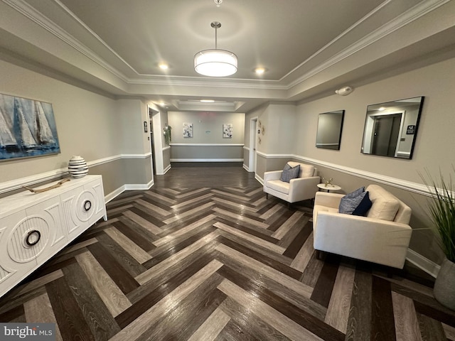 interior space featuring dark parquet floors, ornamental molding, and a tray ceiling