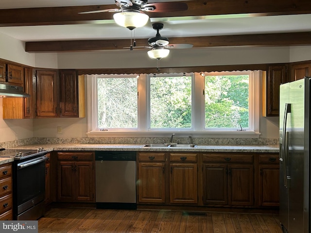 kitchen featuring dark hardwood / wood-style flooring, appliances with stainless steel finishes, beamed ceiling, ceiling fan, and sink