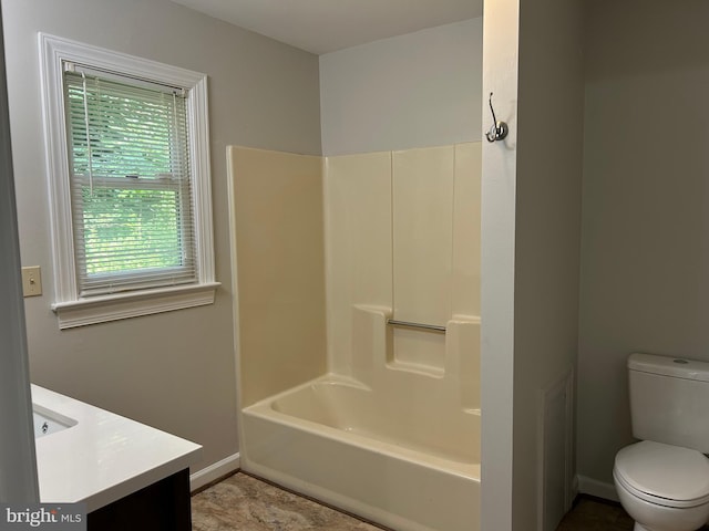 full bathroom featuring  shower combination, vanity, tile patterned flooring, and toilet