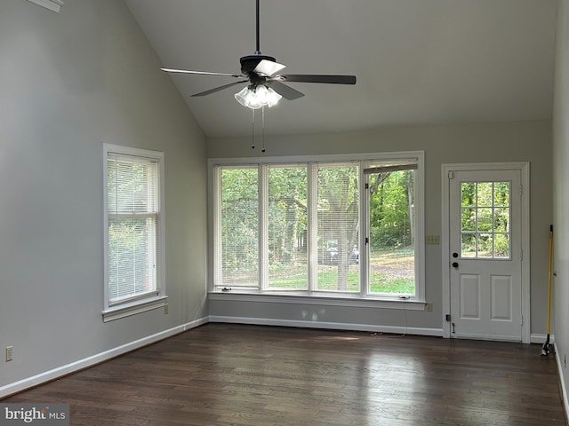 interior space with ceiling fan, high vaulted ceiling, dark wood-type flooring, and a healthy amount of sunlight