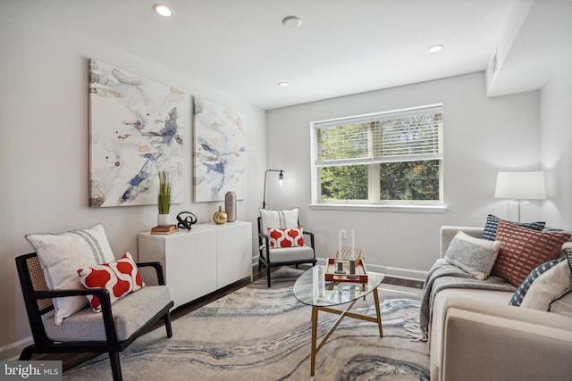 living room featuring radiator heating unit and hardwood / wood-style floors