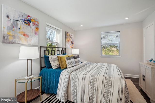 bedroom with hardwood / wood-style floors