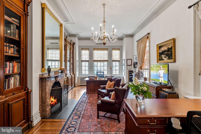 office space featuring dark wood-type flooring, ornamental molding, and an inviting chandelier