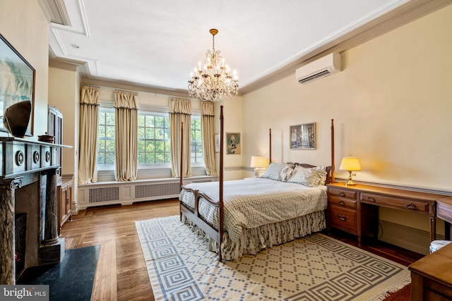 bedroom with an AC wall unit, ornamental molding, radiator heating unit, and an inviting chandelier