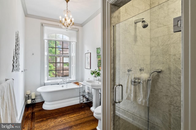 bathroom with toilet, hardwood / wood-style flooring, plus walk in shower, and plenty of natural light